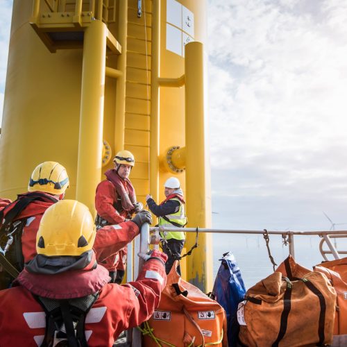 engineers-preparing-to-climb-wind-turbine-on-offsh-2024-10-18-09-54-45-utc